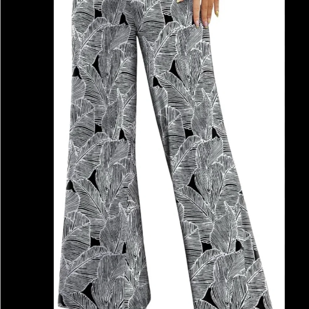 Arolina Small Flared Palazzo Resort Wear in black and white with a palm pattern - Picture 1 of 7